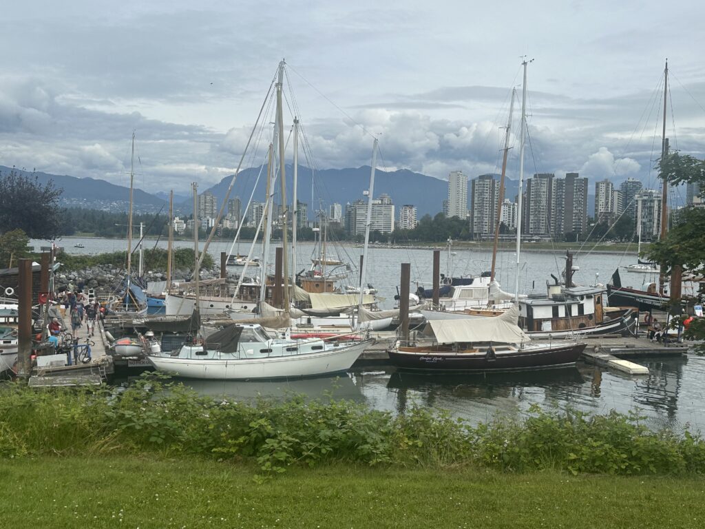 Quintessential Vancouver: Yachts & sailboats, the sea, skyscrapers, and mountains.