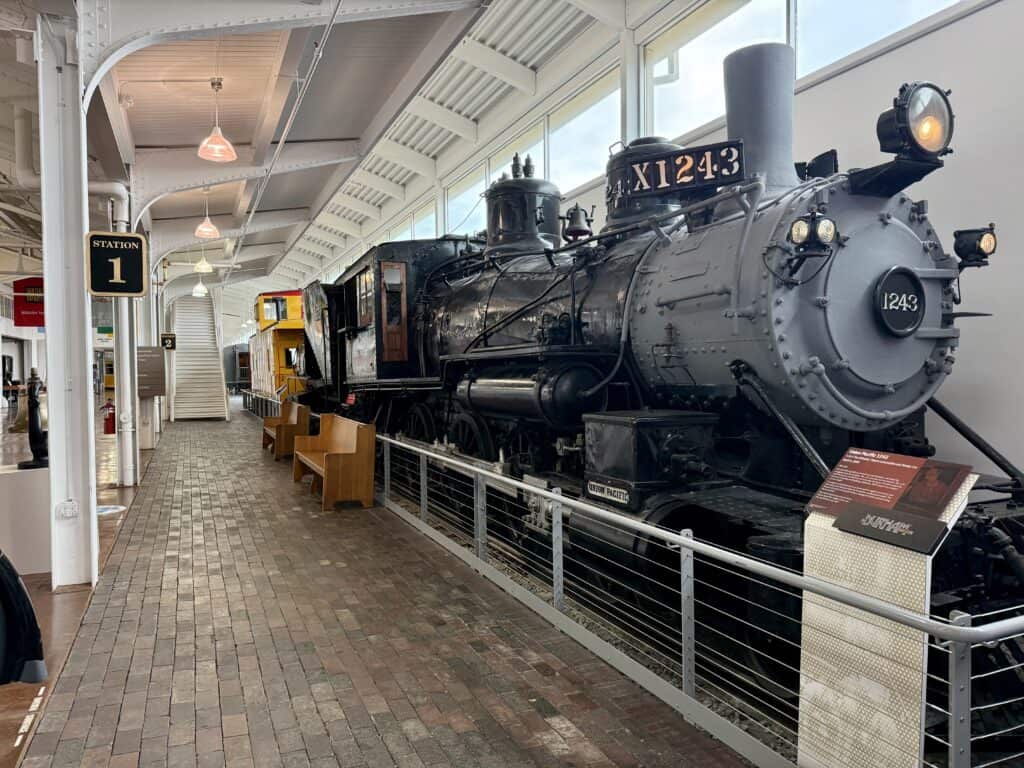 Several full-sized cars of a restored steam engine.  