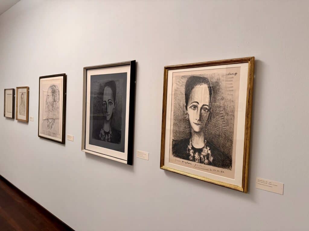 Several sketches of a young Angela Rosengart lining a white wall.