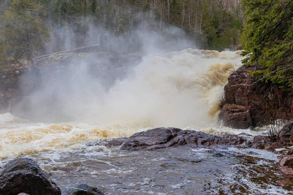 Thundering falls with mist spreading in every direction.