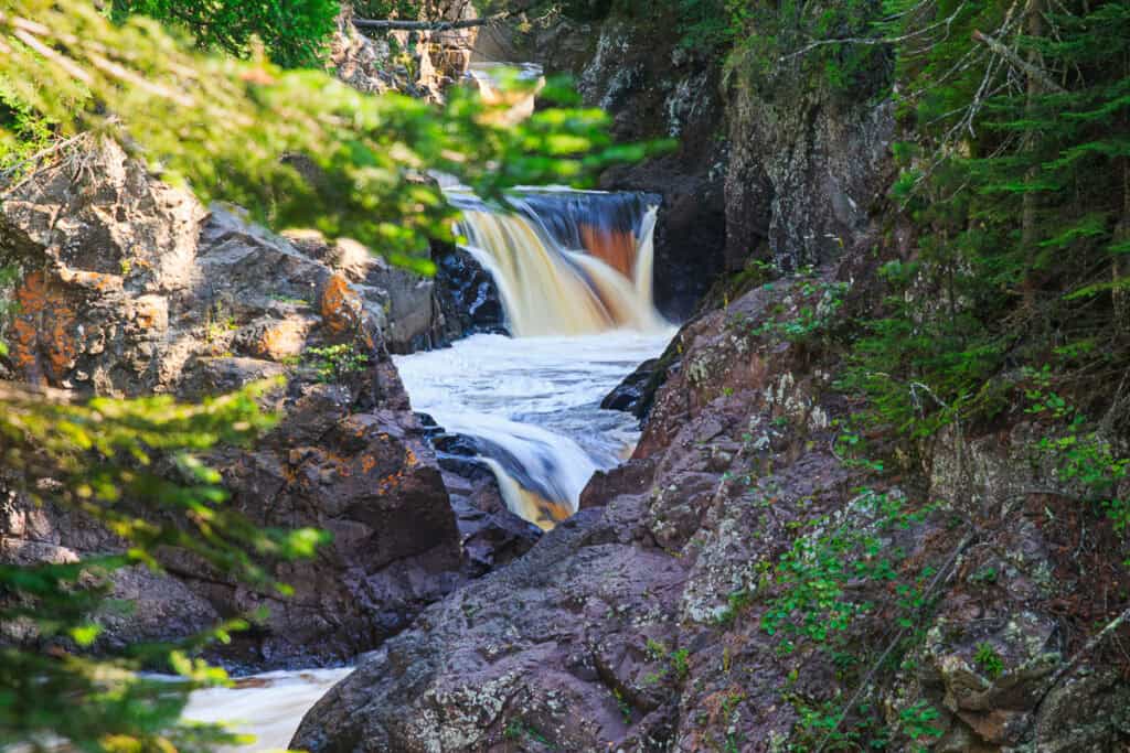 A closer view of two of the tiers of The Cascades coming down beside the steep rock walls.