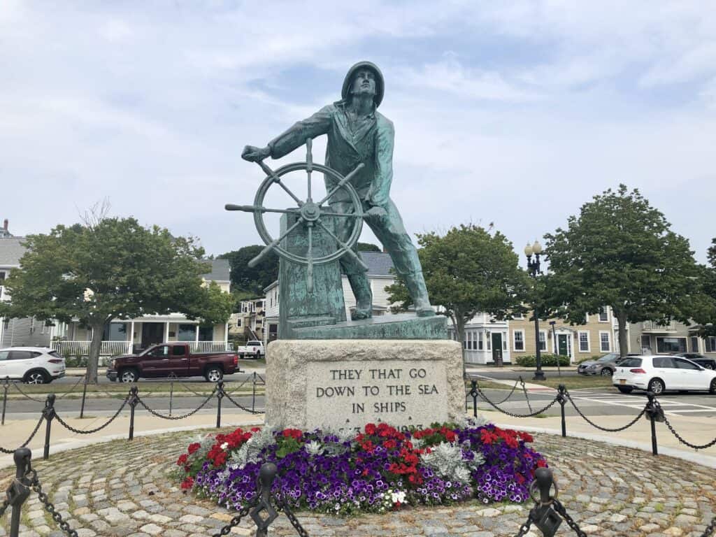 Fisherman's Memorial in Gloucester.  A bronze statue of a fisherman at the wheel of his ship.